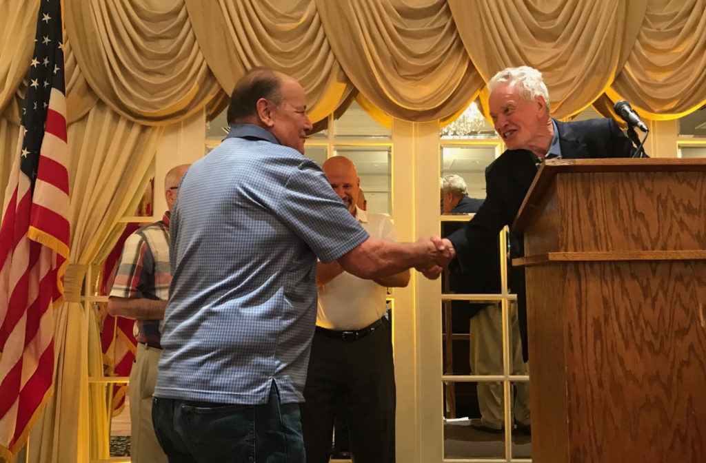 Mike Thornton shakes hands with award winner, Local 6 dinner