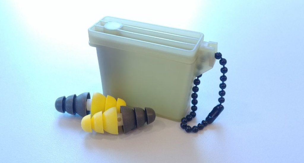 Photograph of dual-sided 3M Combat Arms earplugs with carrying case